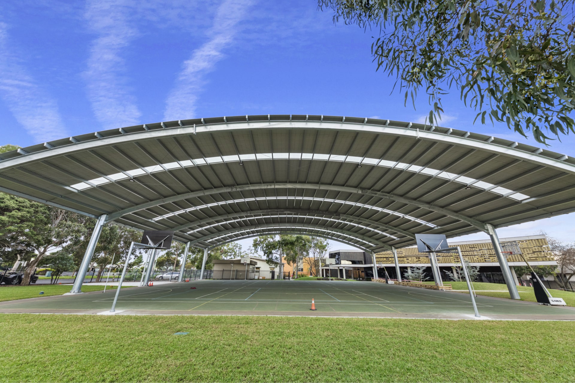 Curved steel school shade cover structure