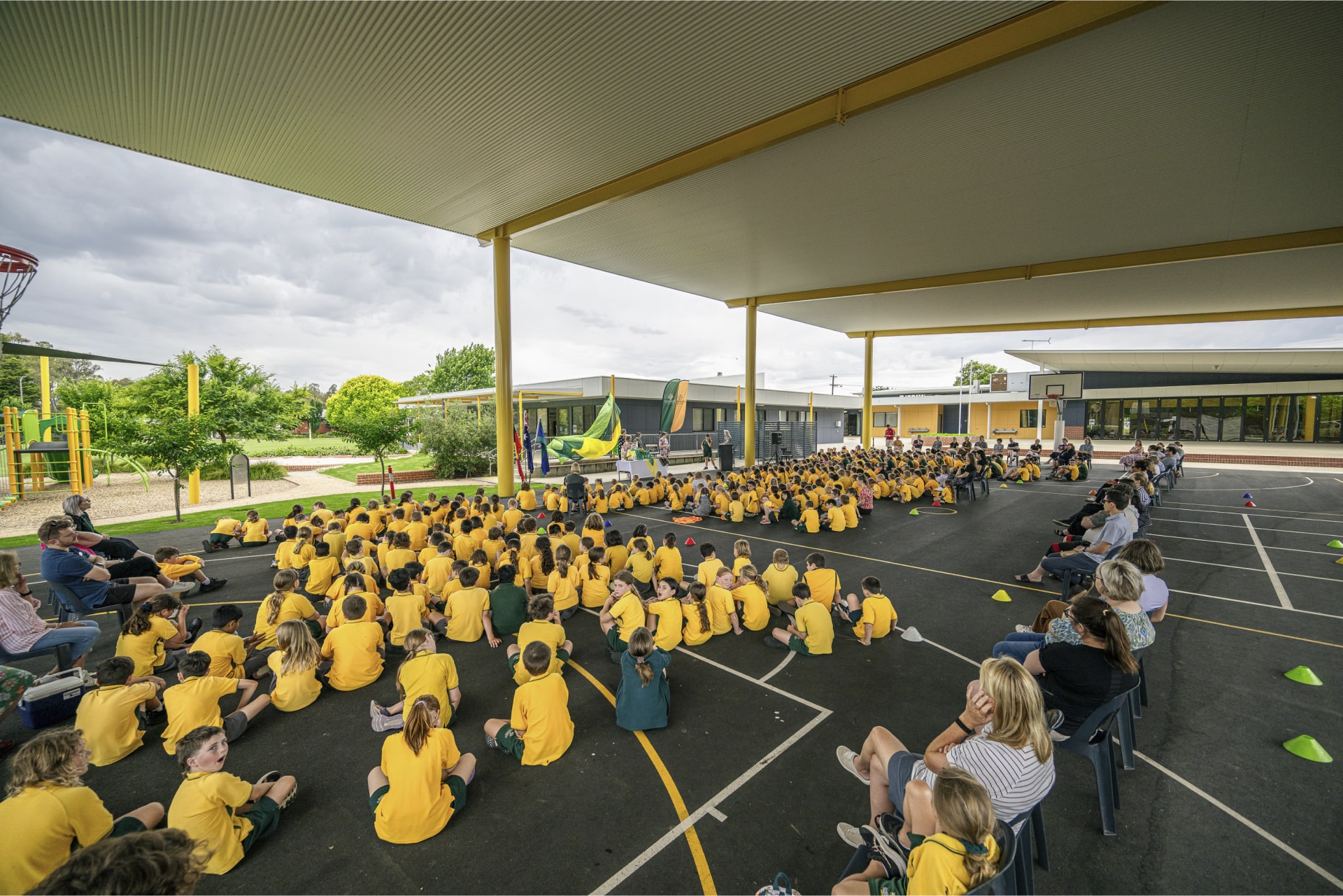 St Bernards Primary School students under steel court cover shade structure