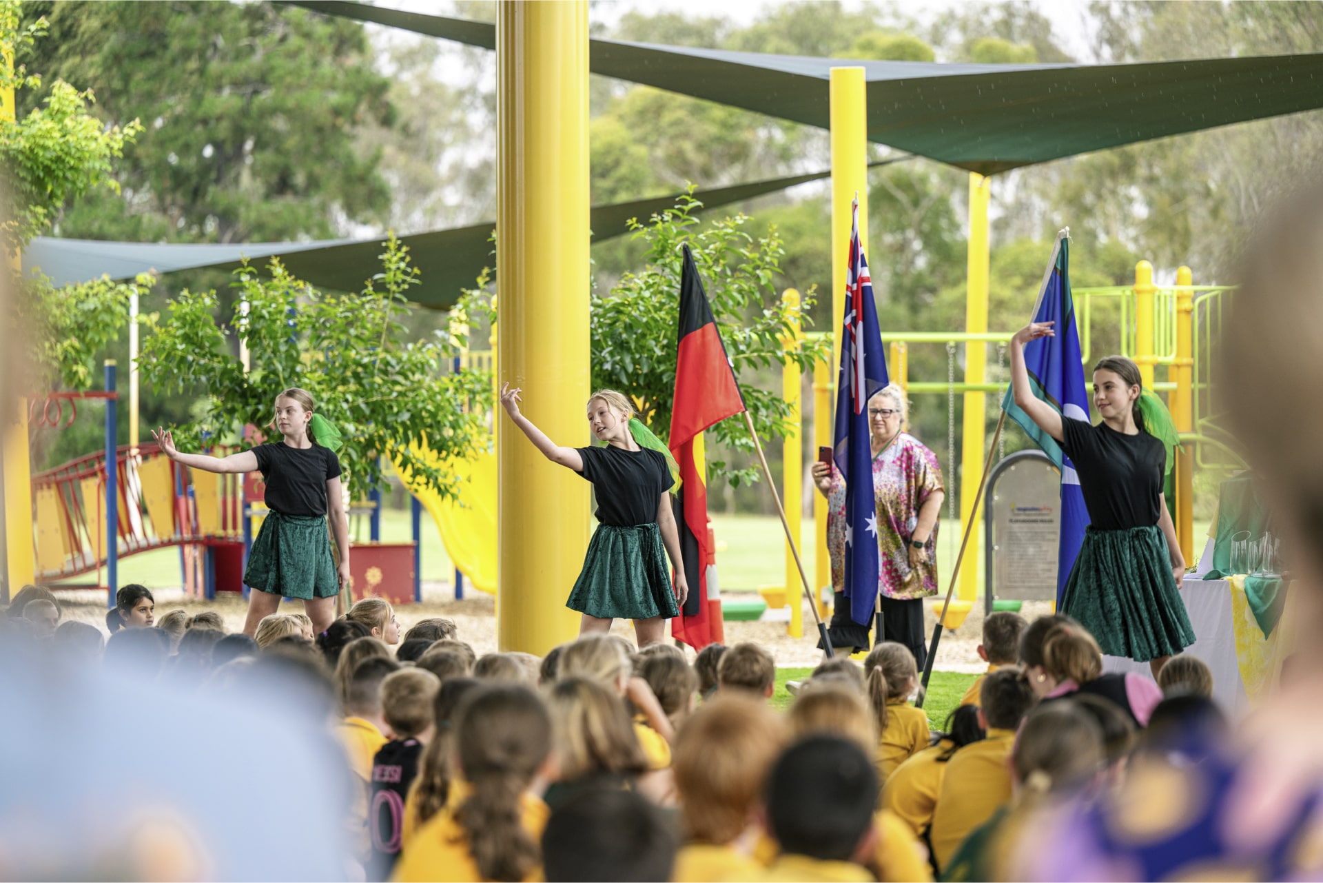 St Bernards Primary School students under steel court cover shade structure